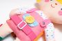 A cuddly toy / doll to dress - double-sided