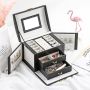 A multi-level casket, a jewelery box - black