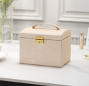 A multi-level casket, a jewelery box - gold