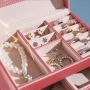 A multi-level casket, a jewelery box - white