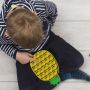 A sensory anti-stress toy in the shape of a pineapple motif