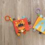 A soft, double-sided book to hang on a pram / car seat - Animals