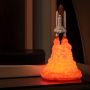 Children's bedside lamp in the shape of a rocket taking off - model 1