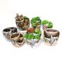 Decorative flower pot with a landscape - a house in the mountains