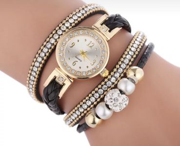 Gold watch with a black bracelet, strap wrapped