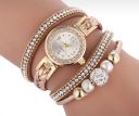 Gold watch with a bracelet, strap wrapped