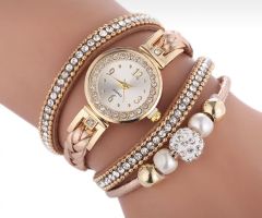 Gold watch with a bracelet, strap wrapped