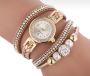 Gold watch with a bracelet, strap wrapped
