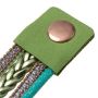 Gold watch with a green bracelet, strap wrapped