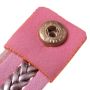 Gold watch with a pink bracelet, strap wrapped