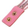 Gold watch with a pink bracelet, strap wrapped