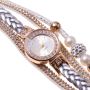 Gold watch with a silver bracelet, strap wrapped