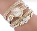 Gold watch with a silver bracelet, strap wrapped