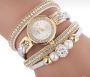 Gold watch with a silver bracelet, strap wrapped