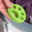 Green paw for cleaning clothes from animal hair