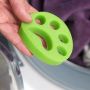 Green paw for cleaning clothes from animal hair