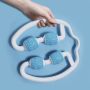Hand-held body massager with rollers - white and blue
