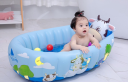 Inflatable baby bathtub with balls - shape of a cow