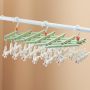 Plastic foldable clothes hanger with clips - 19 clips - green