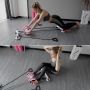 Roller with a base for exercising the abdominal muscles - pink