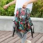 Travel backpack with space for a laptop - colourful leaves