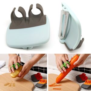 Vegetable and fruit peeler with finger grip - black and blue